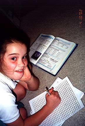 Munch back to doing homework ... she likes it!