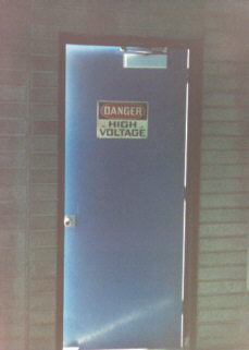 Image of door with high voltage danger sign